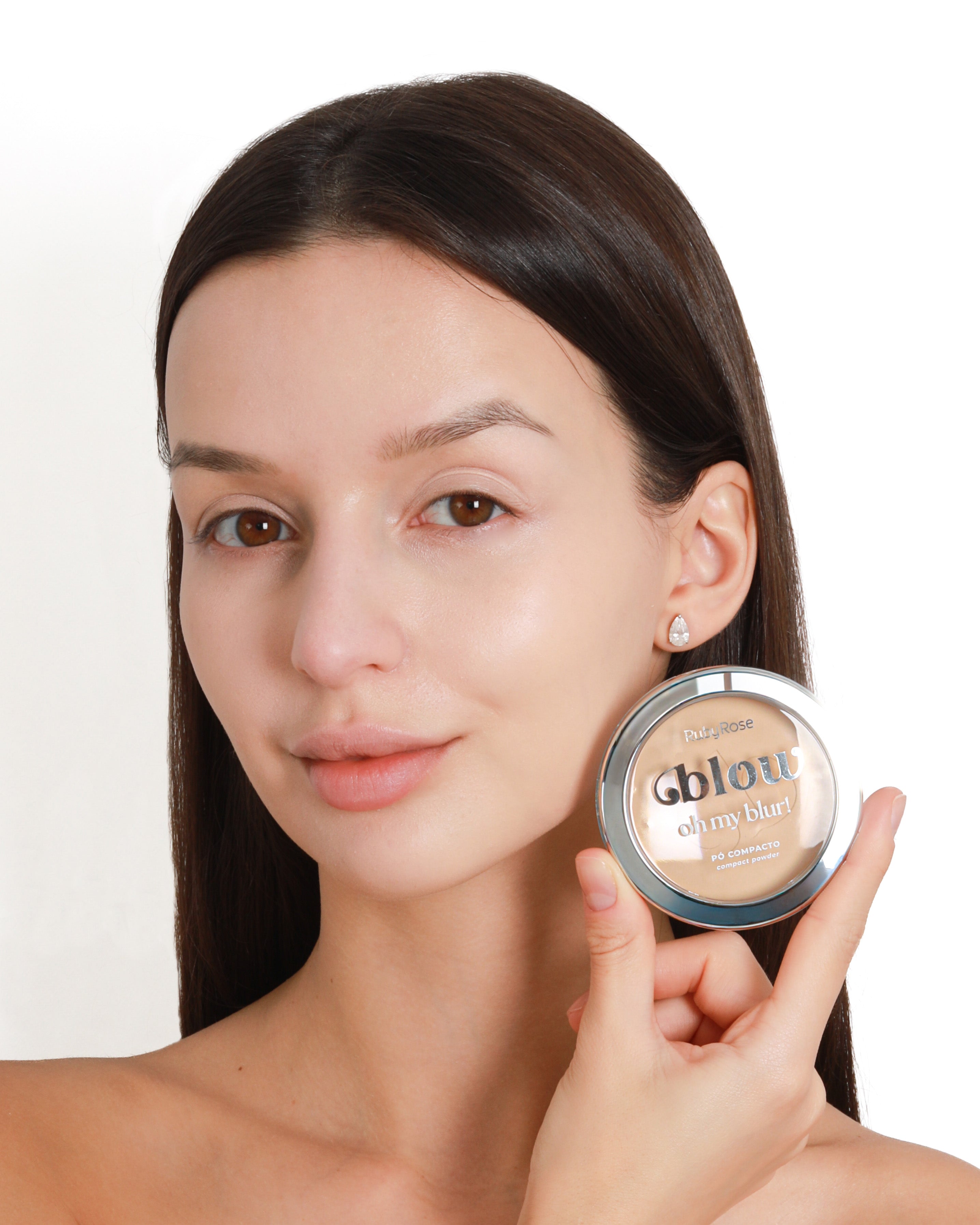 Model holding the Blow Oh My Blur! compact powder